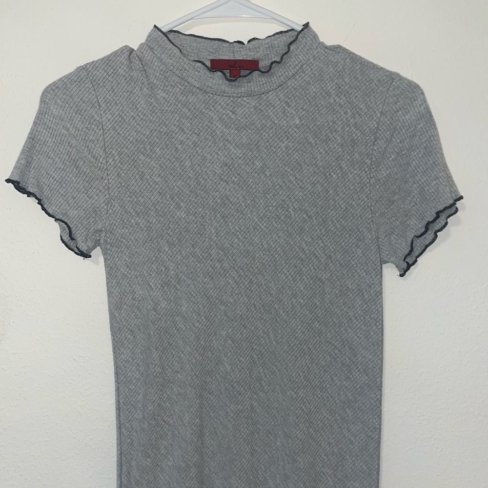 size S. brand- BKE. tightly fitted. outlined with black ruffles